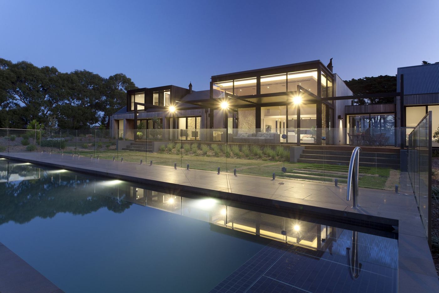The Range: hillside residence at dusk with lit pool